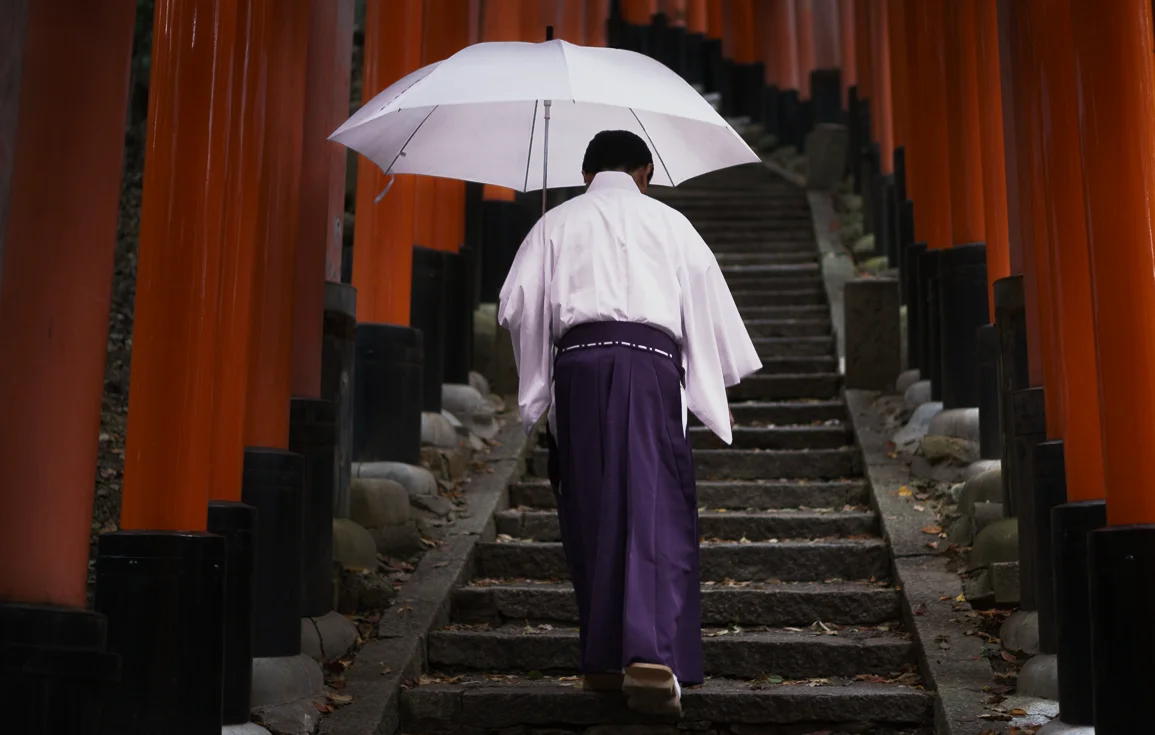 Shinto priest at Fushimi Inari Shrine, Kyoto, Japan.